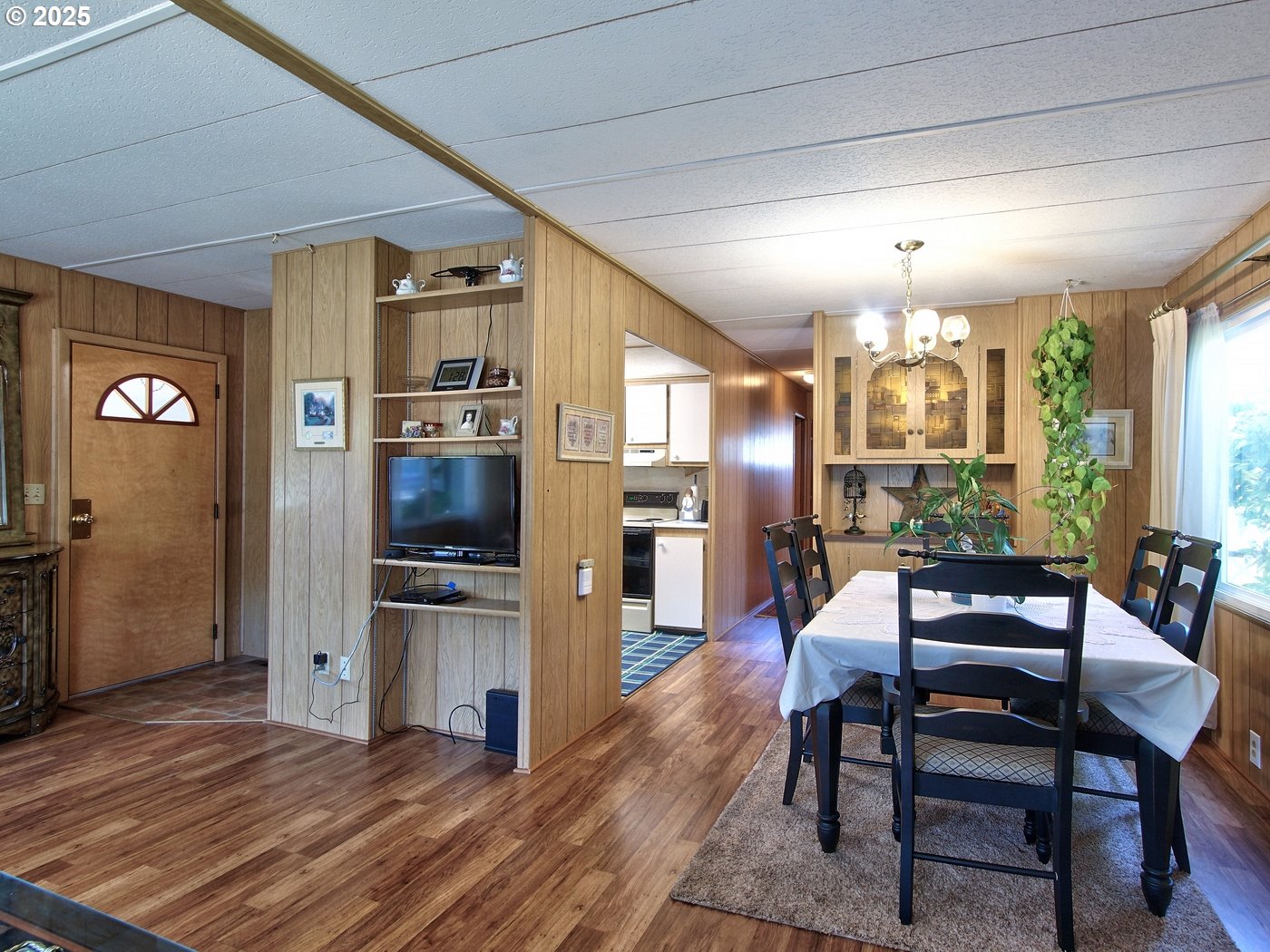 2681 Southeast River Road, Unit 44 Hillsboro, OR 97123 - Photo 19 of 47 a view of a dining room with furniture and wooden floor