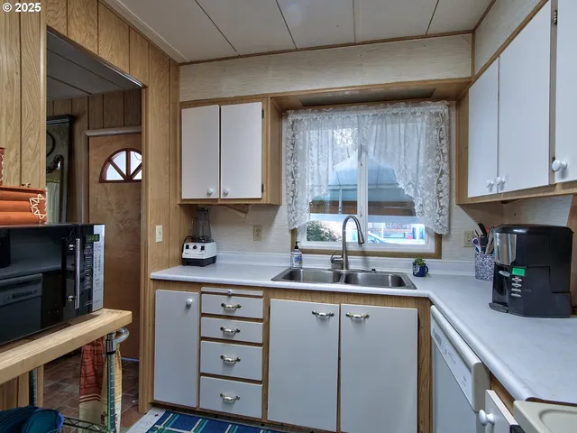 a kitchen with stainless steel appliances granite countertop a stove and a refrigerator