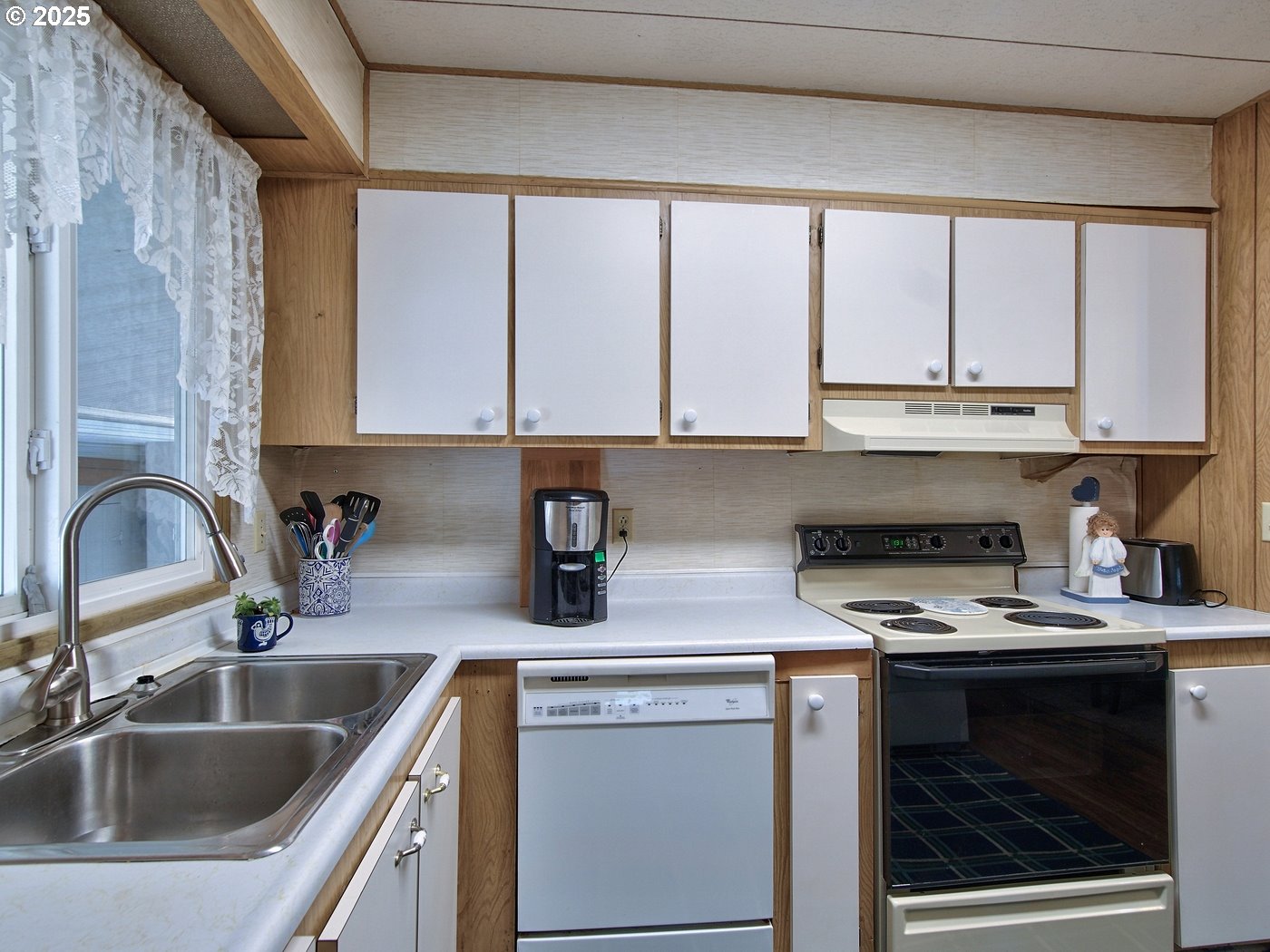 2681 Southeast River Road, Unit 44 Hillsboro, OR 97123 - Photo 22 of 47 a kitchen with a sink cabinets and window