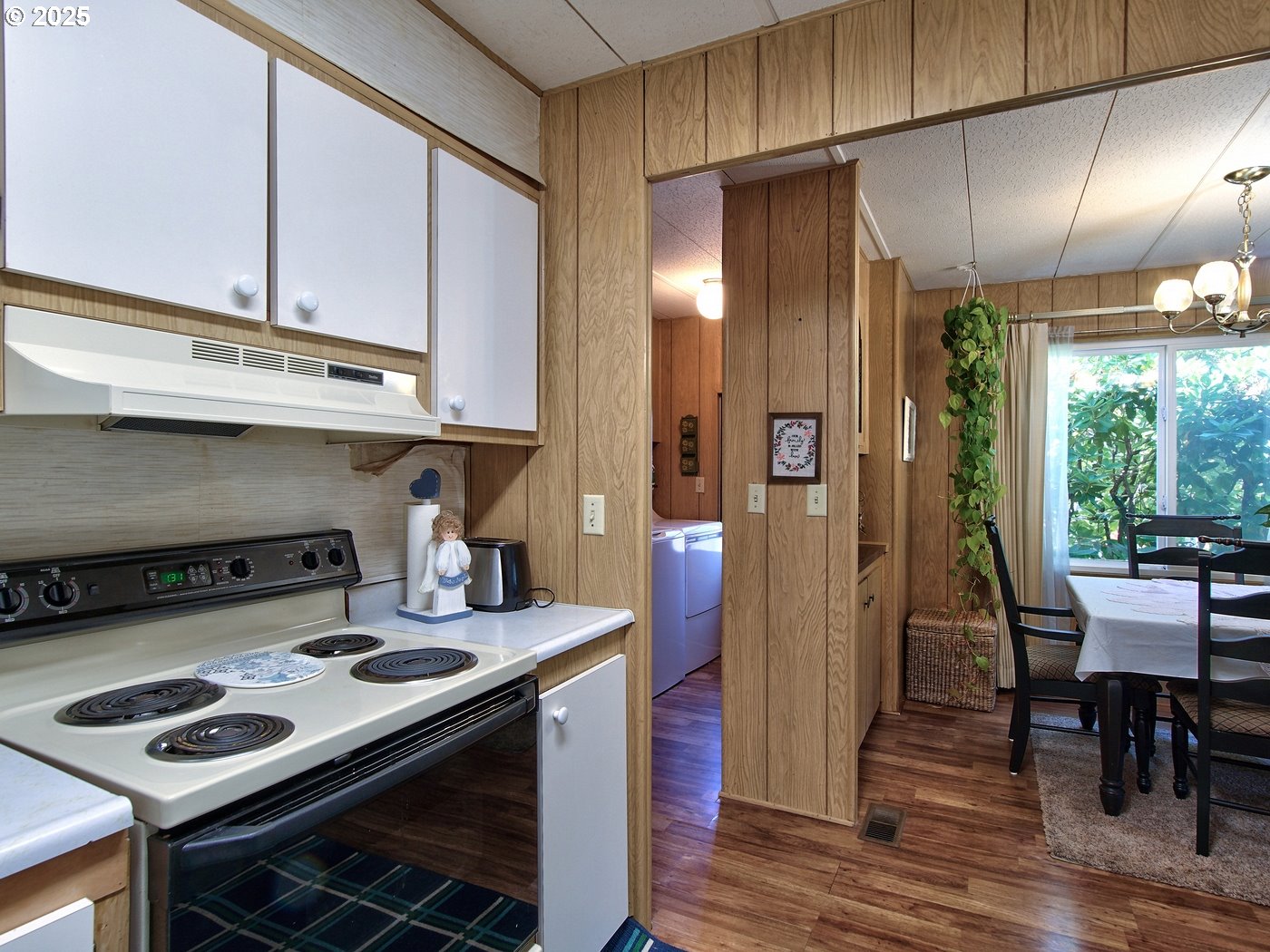 2681 Southeast River Road, Unit 44 Hillsboro, OR 97123 - Photo 23 of 47 a kitchen with stainless steel appliances granite countertop a stove and a refrigerator