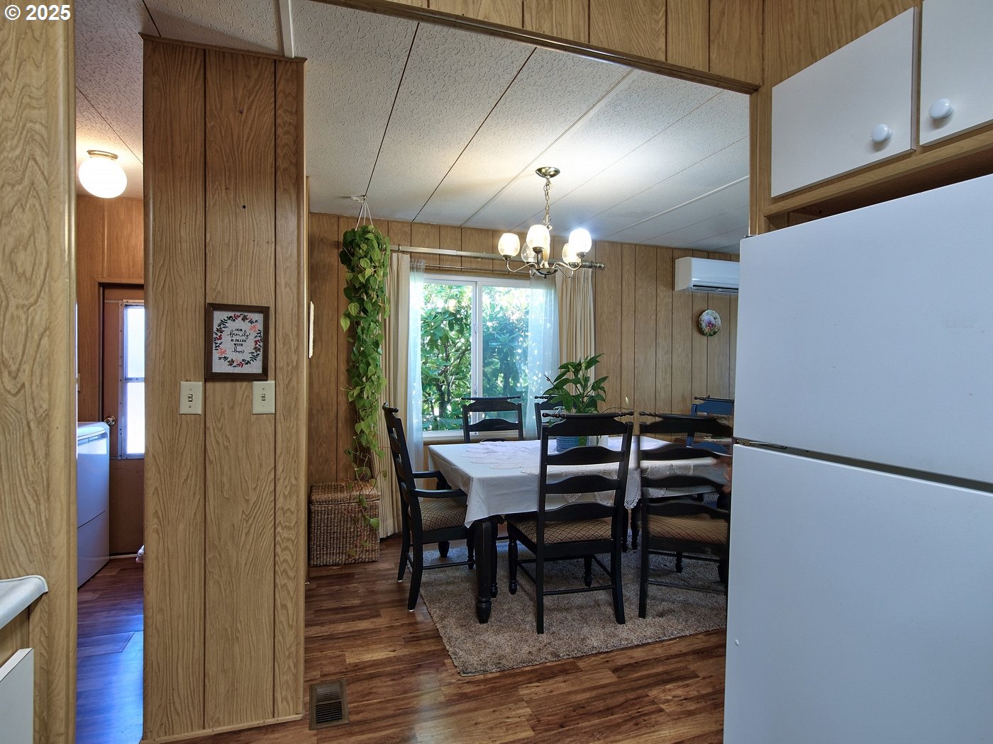2681 Southeast River Road, Unit 44 Hillsboro, OR 97123 - Photo 24 of 47 a view of a dining room with furniture and wooden floor