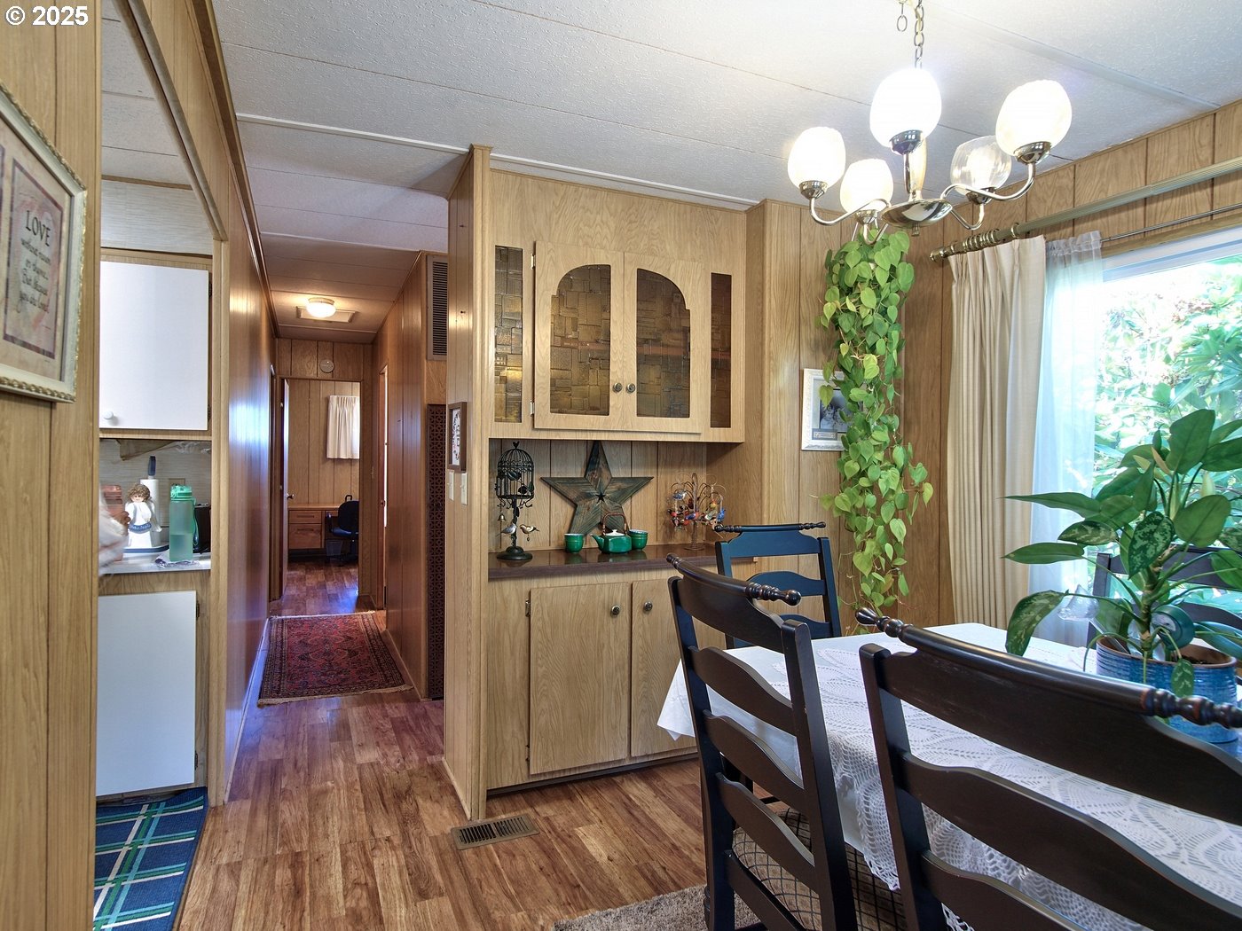 2681 Southeast River Road, Unit 44 Hillsboro, OR 97123 - Photo 27 of 47 a view of a dining room with furniture window and wooden floor