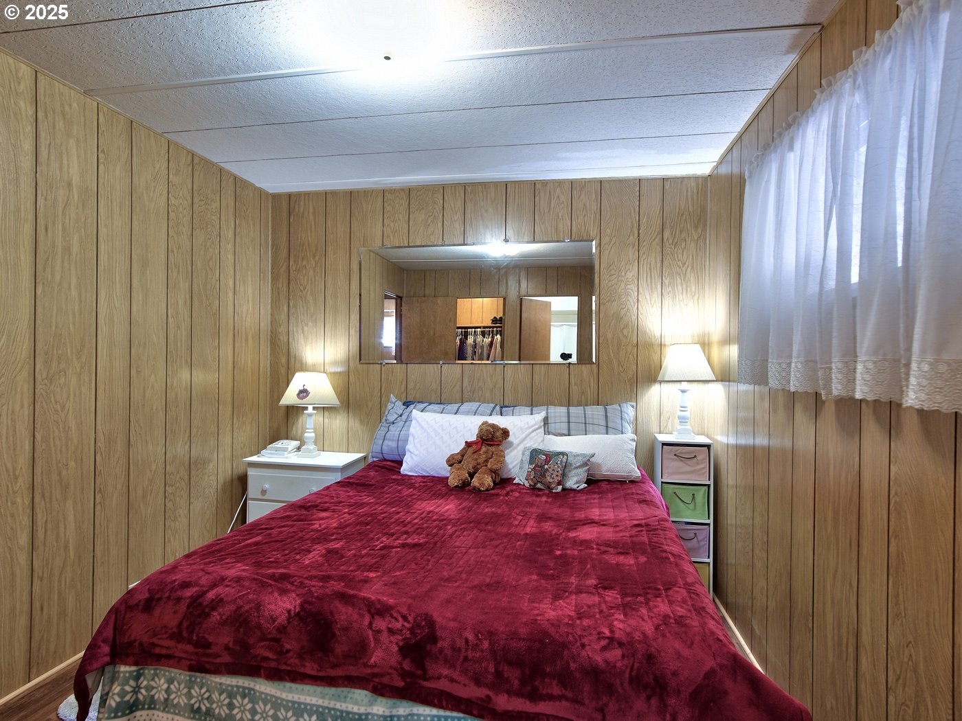 2681 Southeast River Road, Unit 44 Hillsboro, OR 97123 - Photo 37 of 47 a bed room with a bed and a large mirror