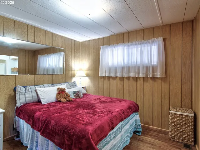 a bed room with a bed and a night stand