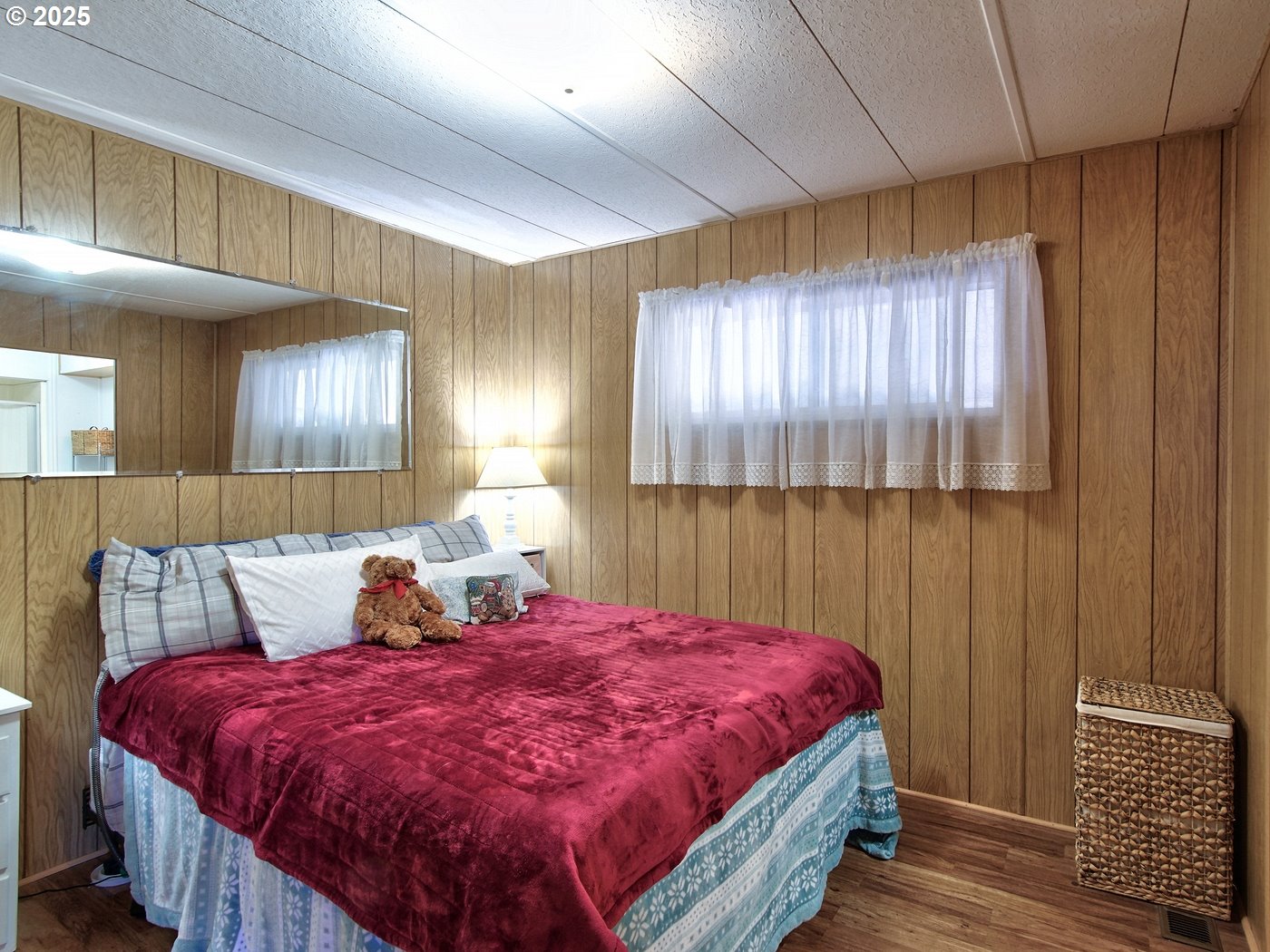 2681 Southeast River Road, Unit 44 Hillsboro, OR 97123 - Photo 4 of 47 a bed room with a bed and a night stand