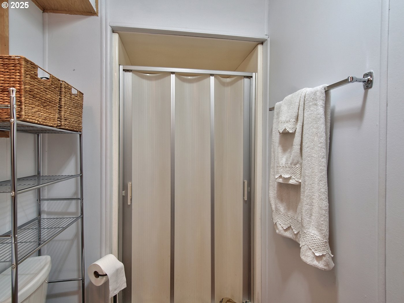 2681 Southeast River Road, Unit 44 Hillsboro, OR 97123 - Photo 41 of 47 a bathroom with a shower and a glass door