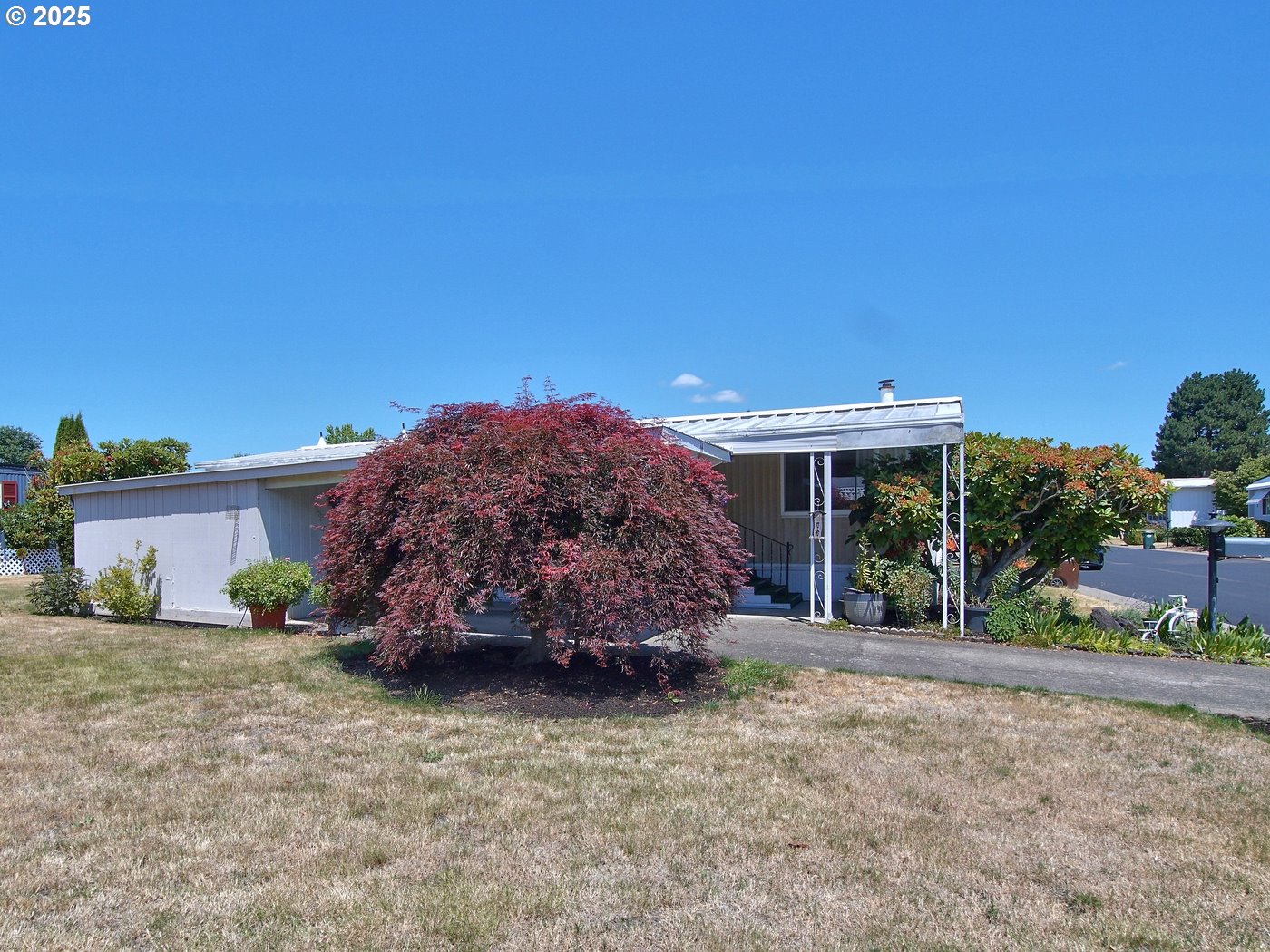 2681 Southeast River Road, Unit 44 Hillsboro, OR 97123 - Photo 42 of 47 a view of a house with a backyard