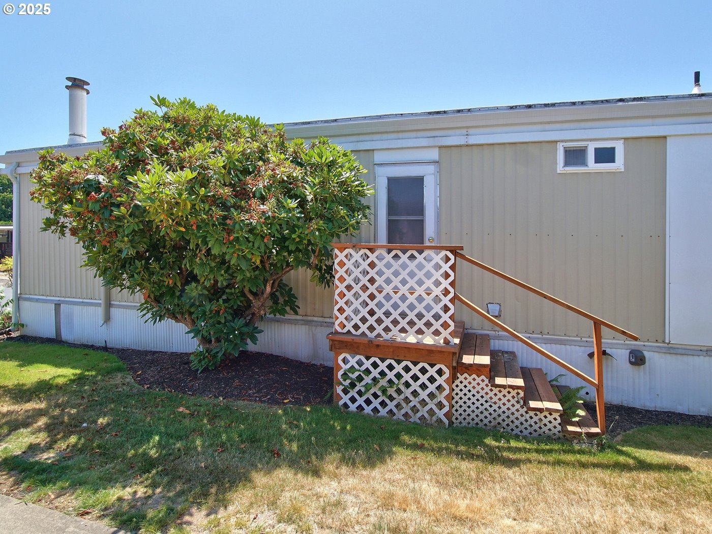 2681 Southeast River Road, Unit 44 Hillsboro, OR 97123 - Photo 46 of 47 a view of a house with a yard