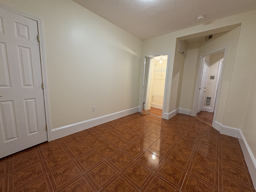 69 Babcock Street, Unit 7 Brookline, MA 02446 - Photo 8 of 9 a view of an empty room and window