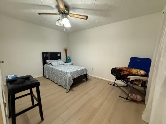 a bedroom with furniture and a bed