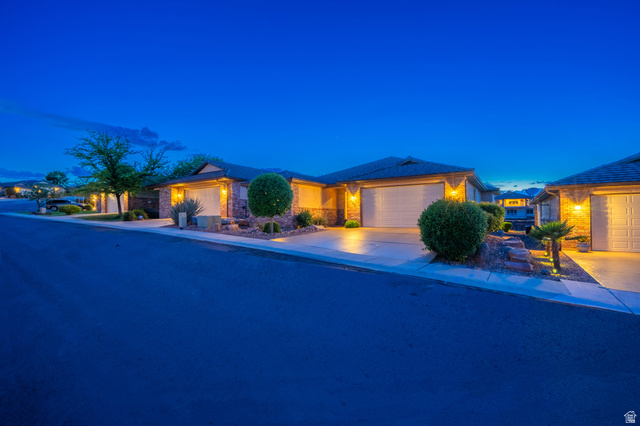2212 Chippenham Court St. George, UT 84770 - Photo 2 of 75 View of front facade with an attached garage, stone siding, and driveway