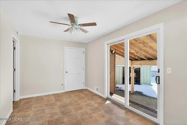 a view of an empty room and window