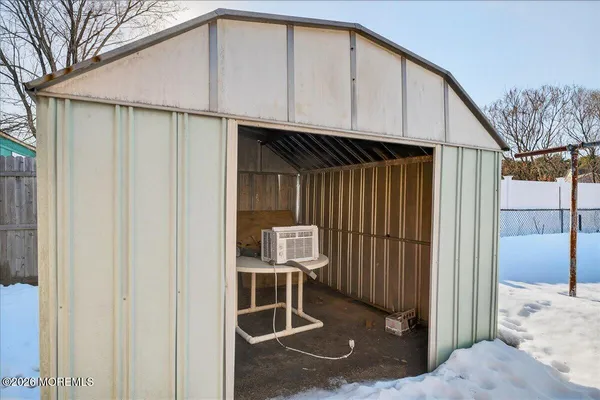 a view of a wooden door of the house