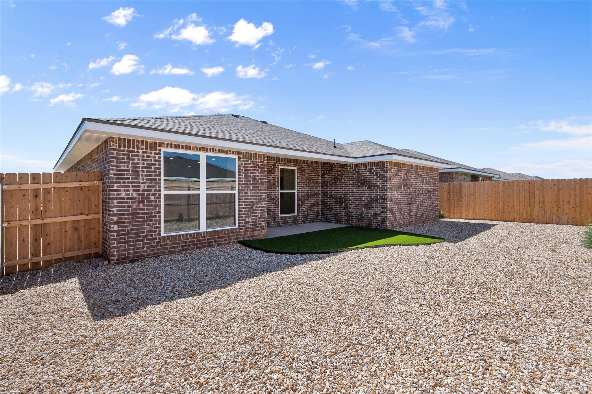 8316 24th Street Lubbock, TX 79407 - Photo 20 of 22 a view of a house with a yard