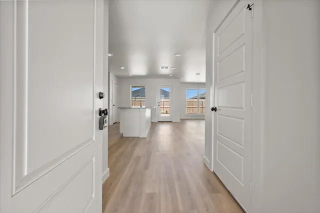 a view of a kitchen from the hallway
