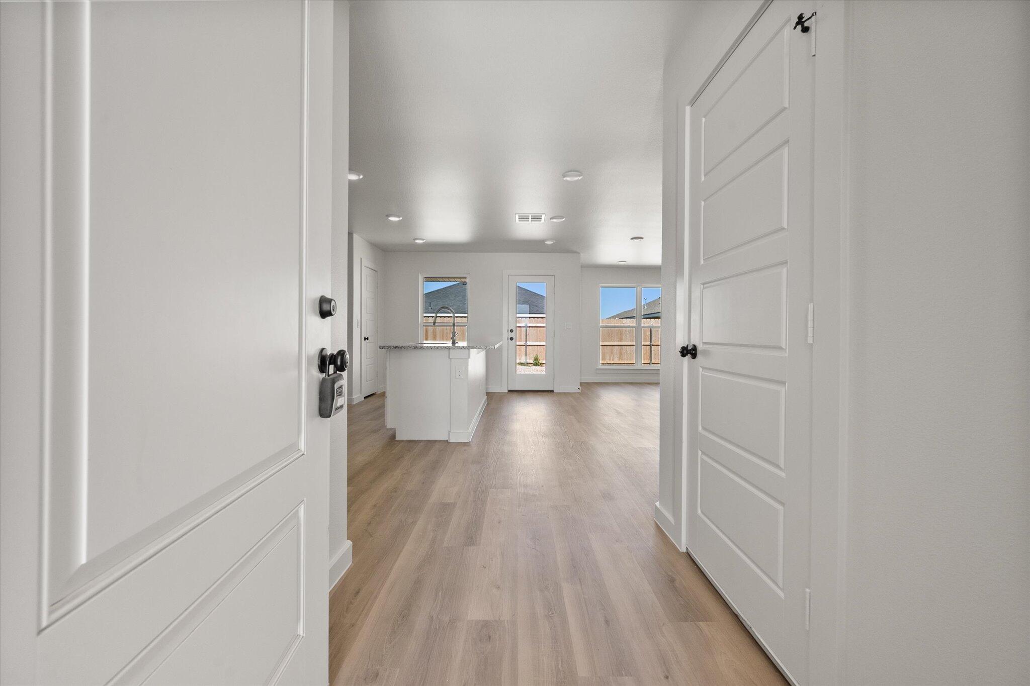 8316 24th Street Lubbock, TX 79407 - Photo 3 of 22 a view of a kitchen from the hallway