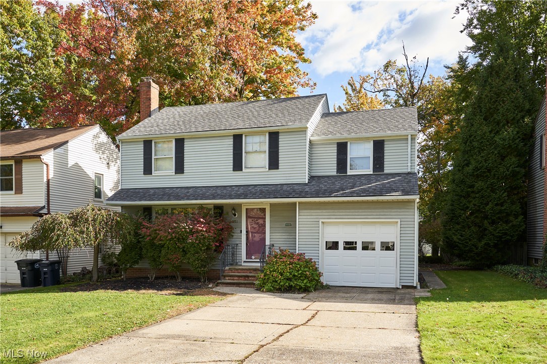 1111 Ford Road Lyndhurst, OH 44124 - Photo 1 of 27 View of front facade with a front lawn and a garage