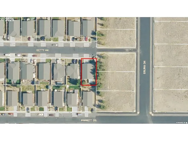 a balcony with table and chairs