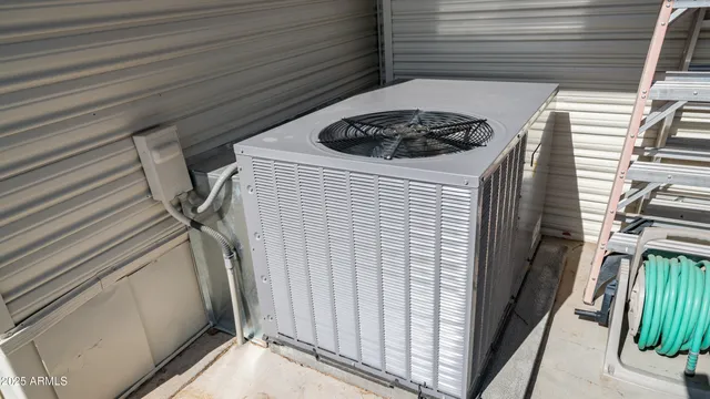 a bedroom with furniture and a large window