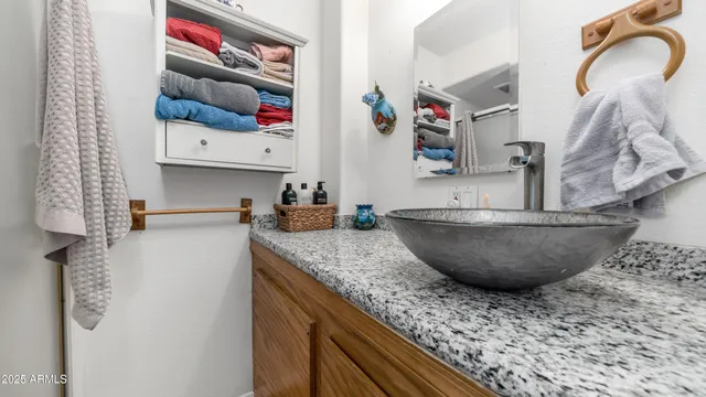 a view of a hallway with workspace and wooden floor