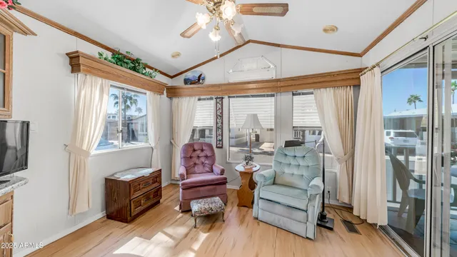 a bedroom with a bed and a large mirror on the dresser