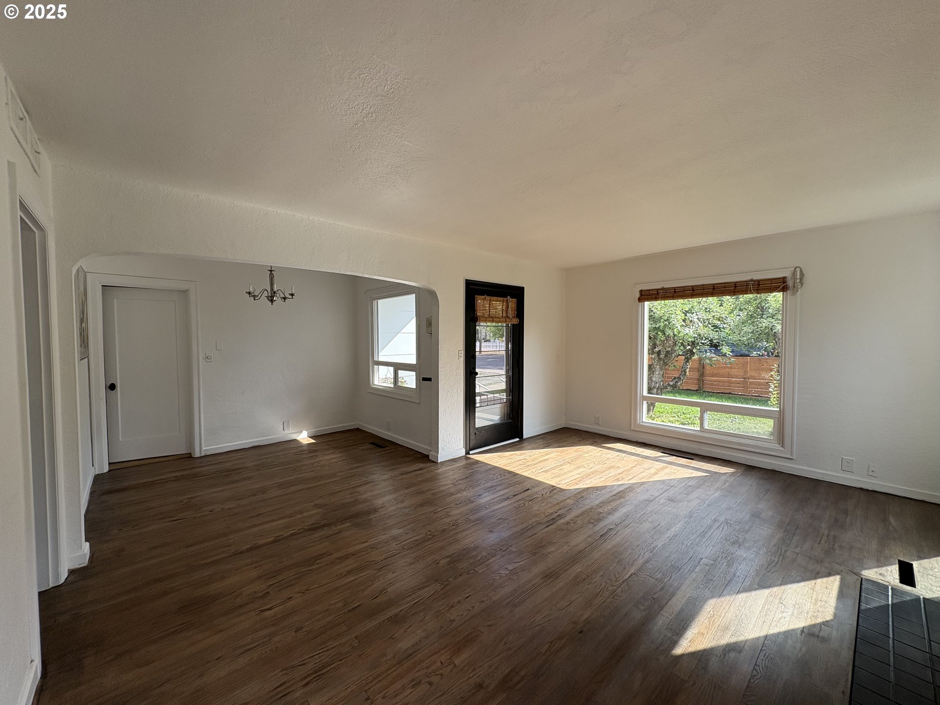 1510 Northwest Broadway Street Albany, OR 97321 - Photo 12 of 32 a view of an empty room with window and wooden floor