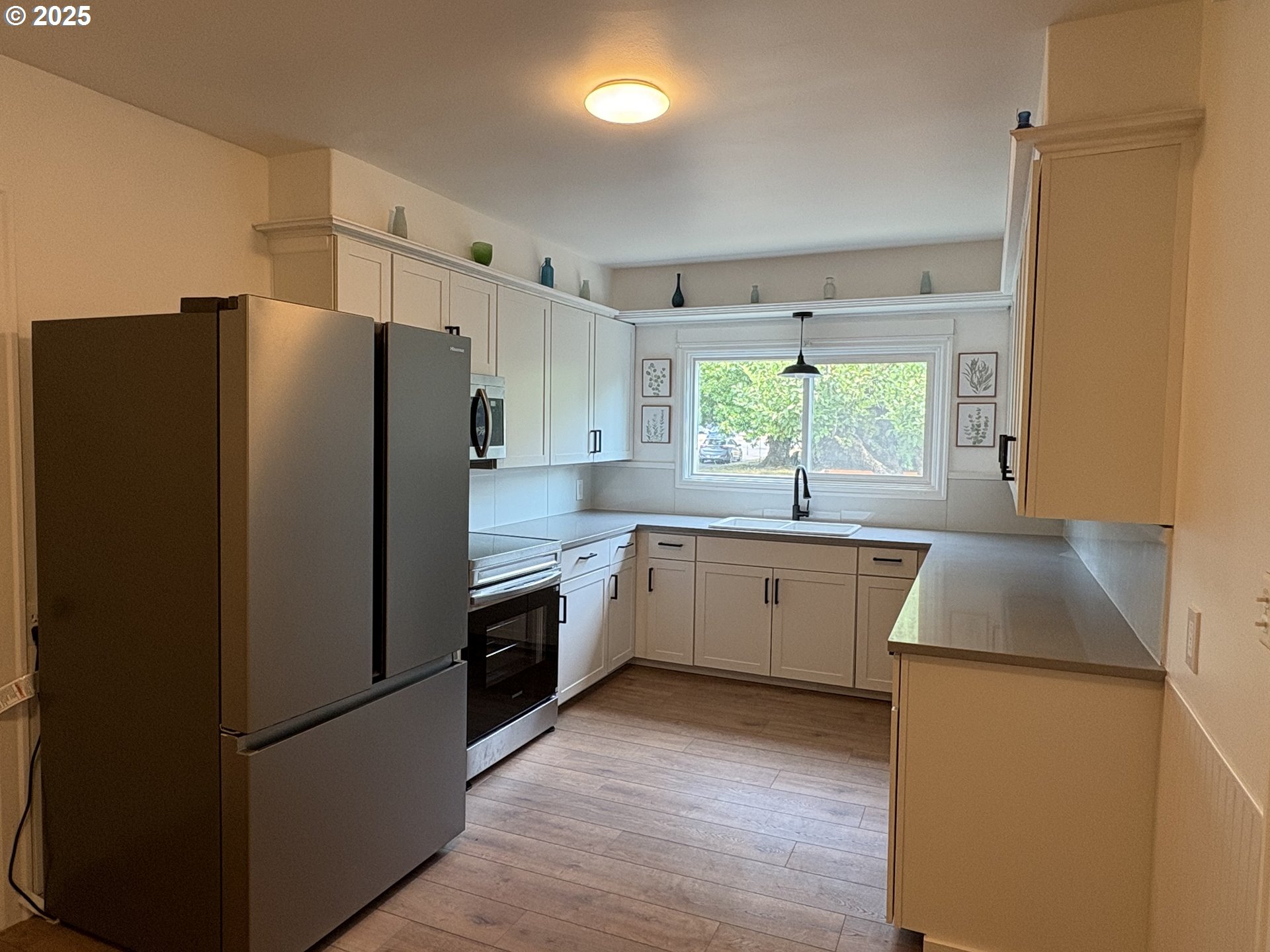 1510 Northwest Broadway Street Albany, OR 97321 - Photo 14 of 32 a kitchen with white cabinets and white stainless steel appliances