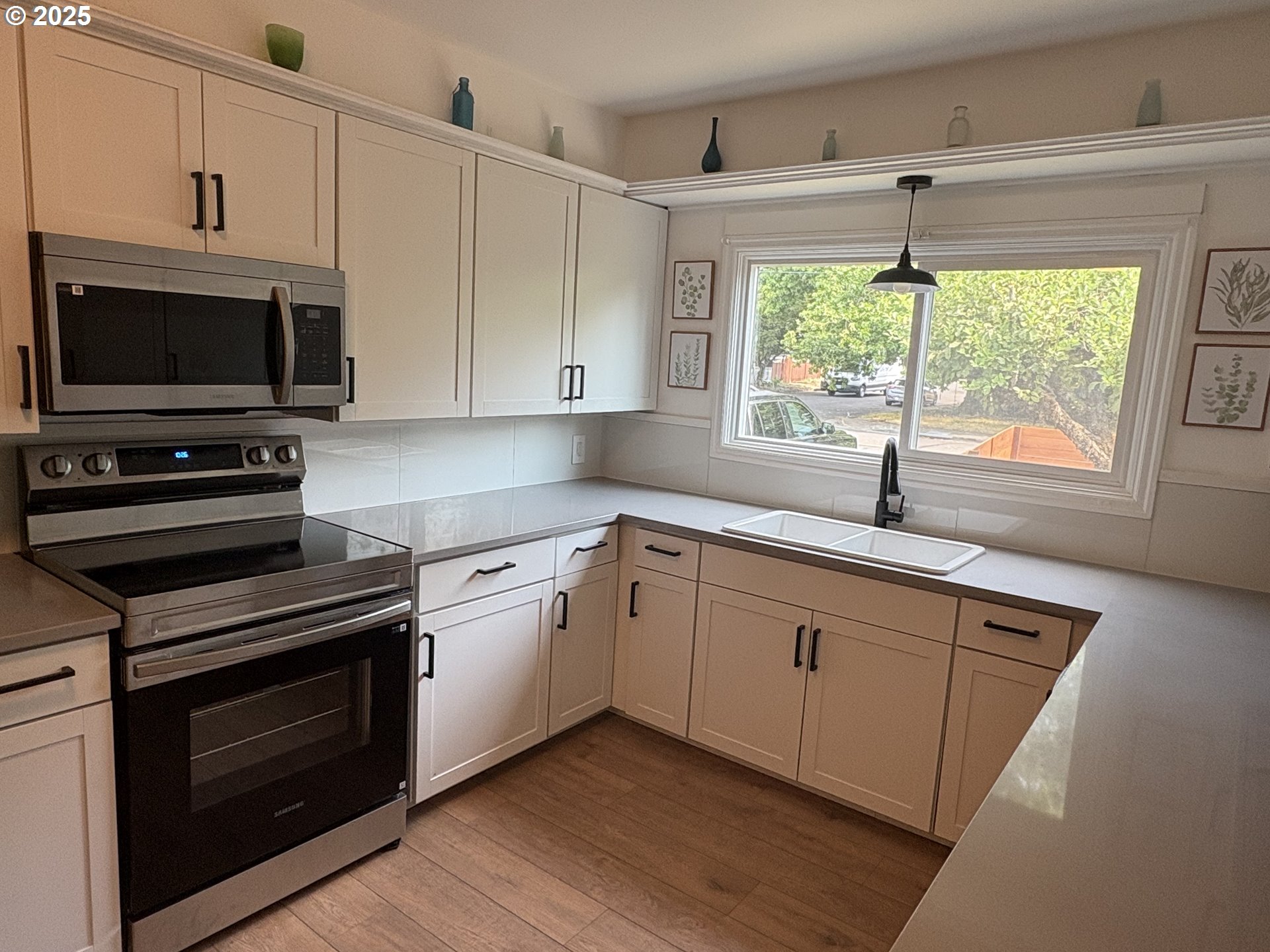 1510 Northwest Broadway Street Albany, OR 97321 - Photo 15 of 32 a kitchen with a sink stove and microwave