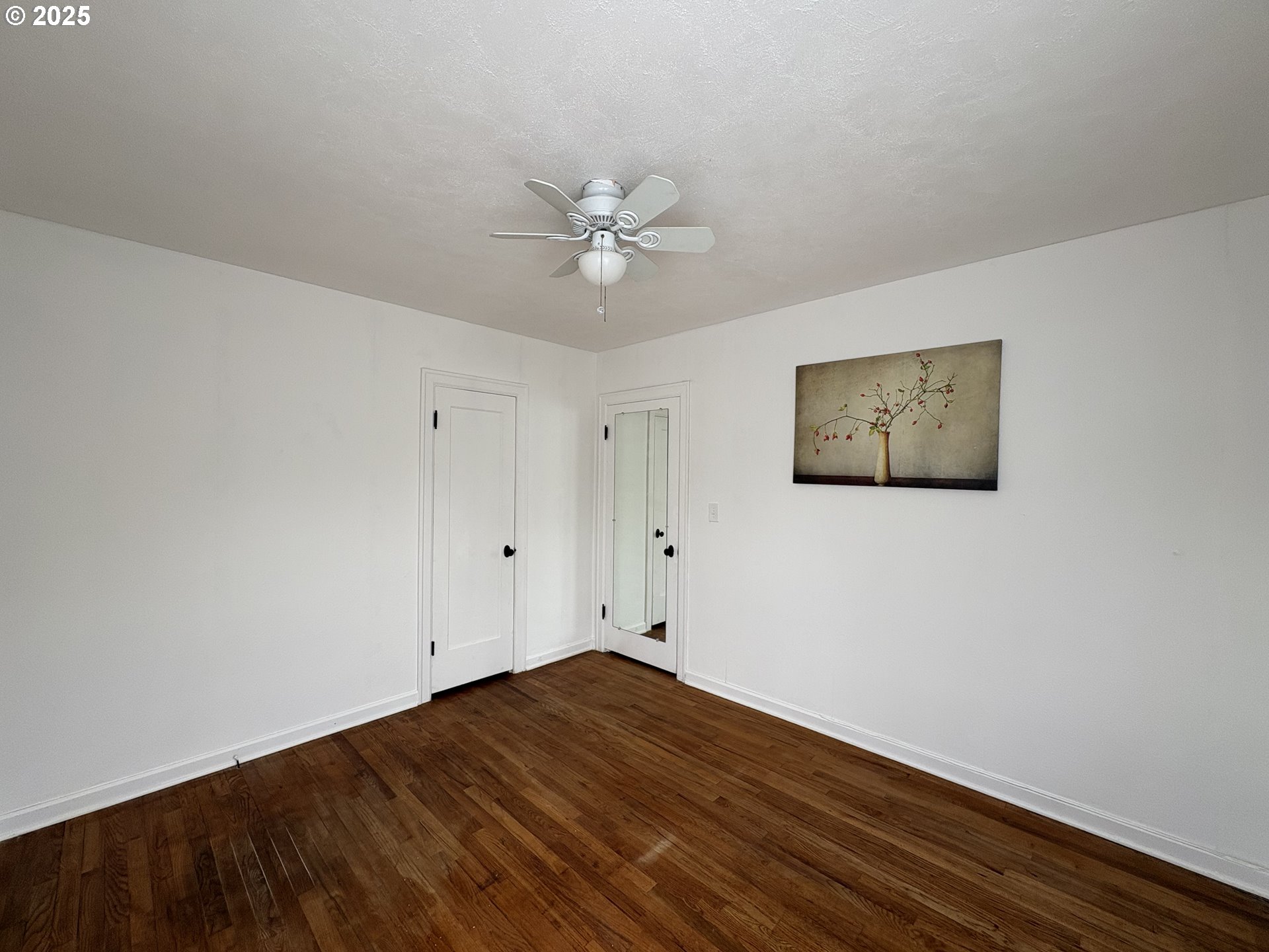 1510 Northwest Broadway Street Albany, OR 97321 - Photo 23 of 32 a view of a room with wooden floor and a ceiling fan