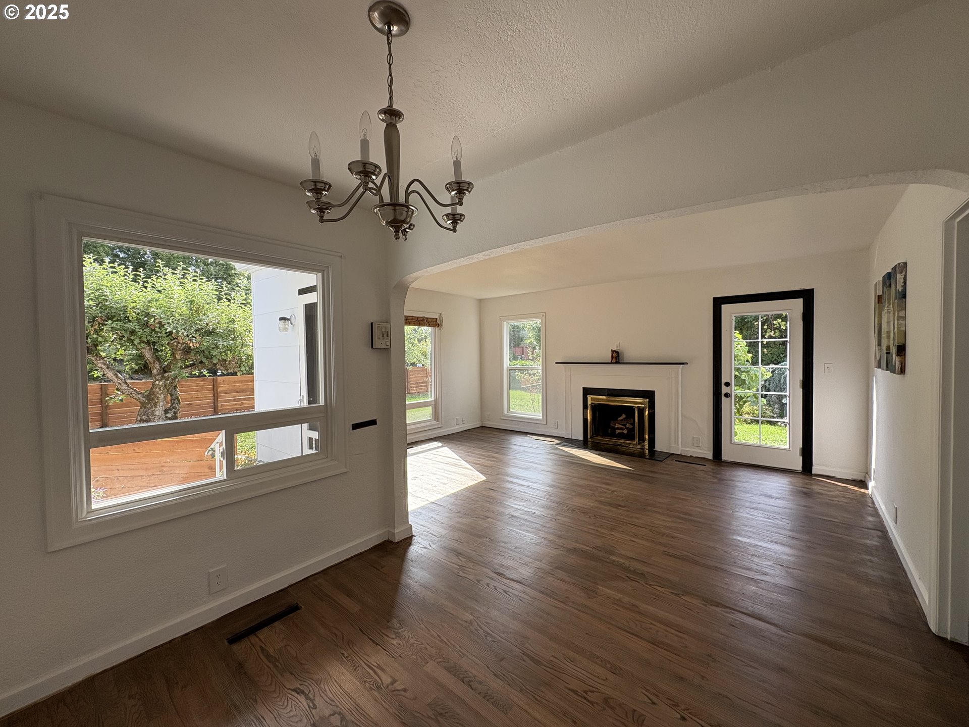 1510 Northwest Broadway Street Albany, OR 97321 - Photo 10 of 32 a view of a livingroom with wooden floor fireplace and windows