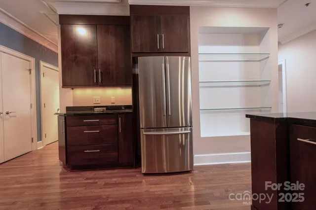 a kitchen with stainless steel appliances granite countertop a stove and a microwave