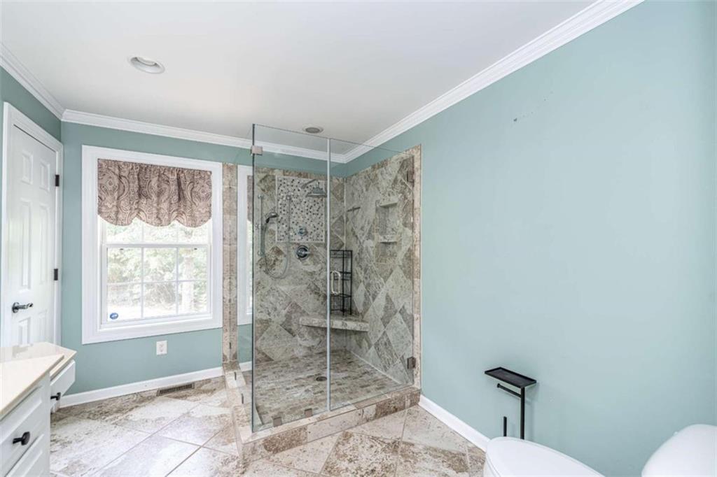 45 Wildflower Road Northeast Rome, GA 30161 - Photo 21 of 36 a bathroom with a shower a toilet and a window