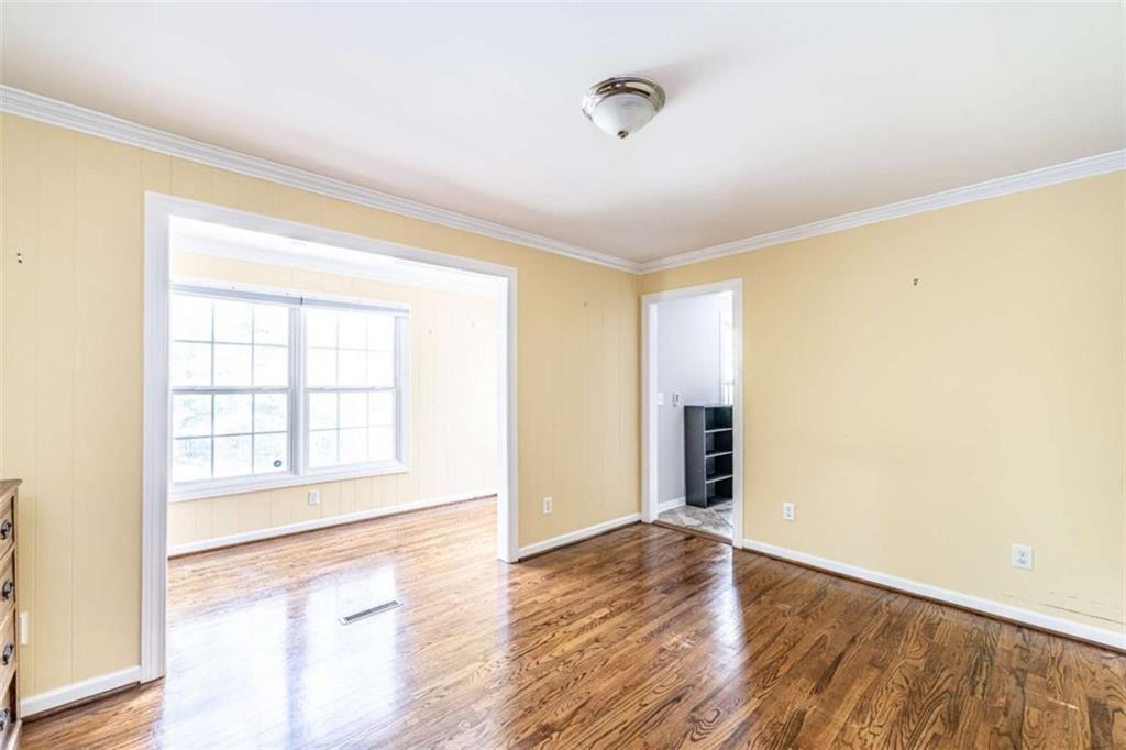 45 Wildflower Road Northeast Rome, GA 30161 - Photo 24 of 36 a view of an empty room with wooden floor and a window