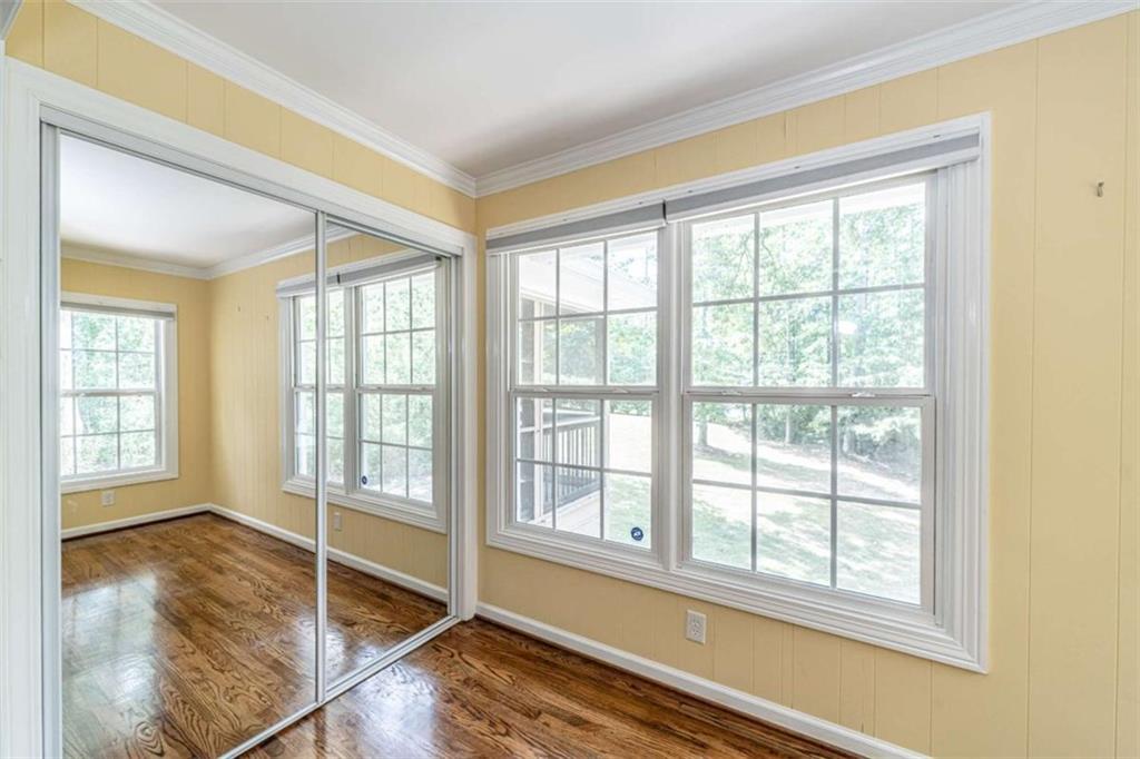 45 Wildflower Road Northeast Rome, GA 30161 - Photo 25 of 36 a view of an empty room with wooden floor and a window