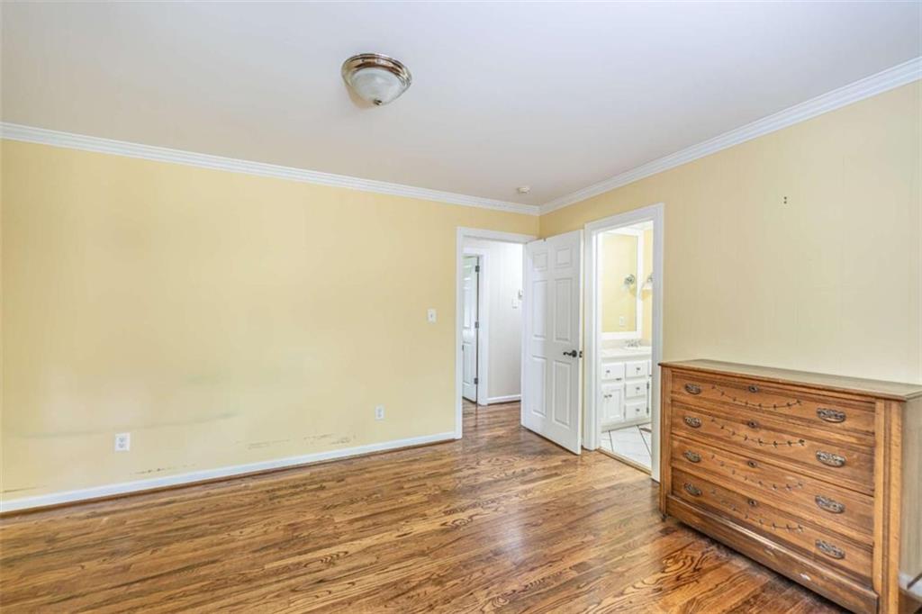 45 Wildflower Road Northeast Rome, GA 30161 - Photo 27 of 36 a view of walk in closet with wooden floor