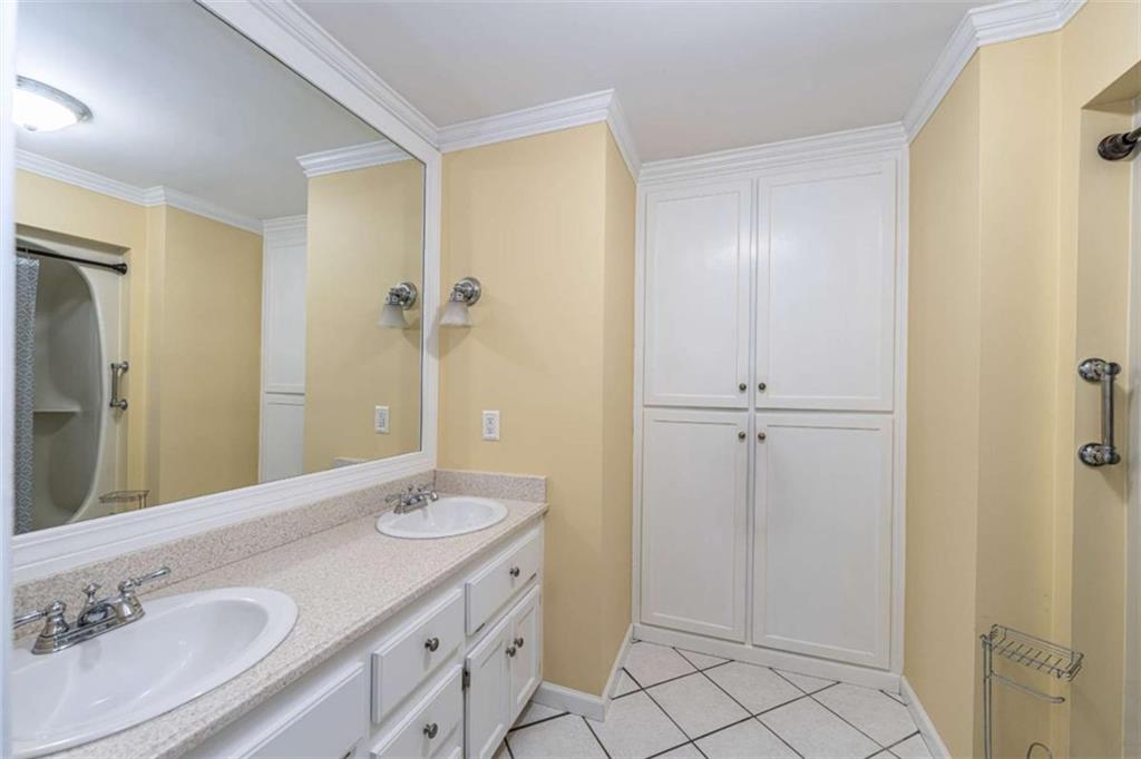 45 Wildflower Road Northeast Rome, GA 30161 - Photo 28 of 36 a bathroom with a granite countertop sink a mirror and a shower