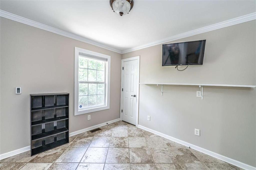 45 Wildflower Road Northeast Rome, GA 30161 - Photo 32 of 36 a view of an empty room with cabinet and a window