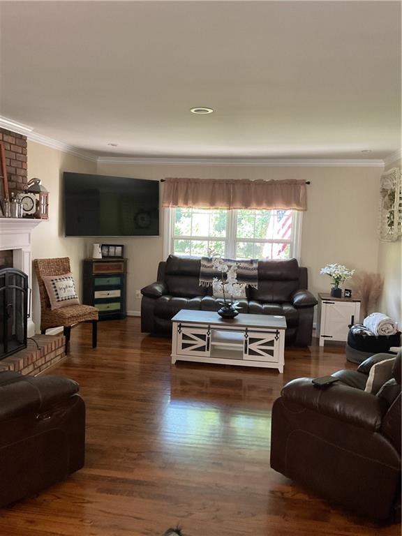 45 Wildflower Road Northeast Rome, GA 30161 - Photo 34 of 36 a living room with furniture flat screen tv and a large window