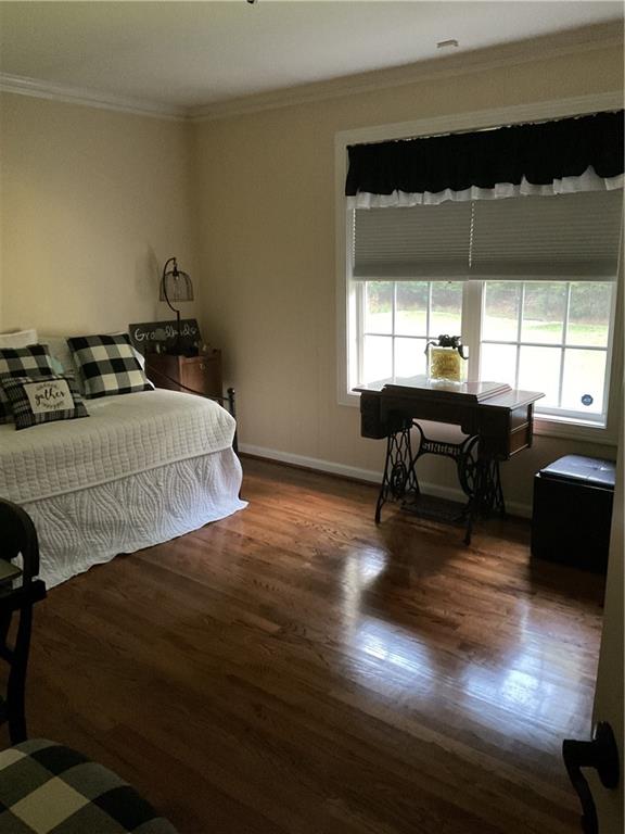 45 Wildflower Road Northeast Rome, GA 30161 - Photo 36 of 36 a bedroom with a bed and a large window