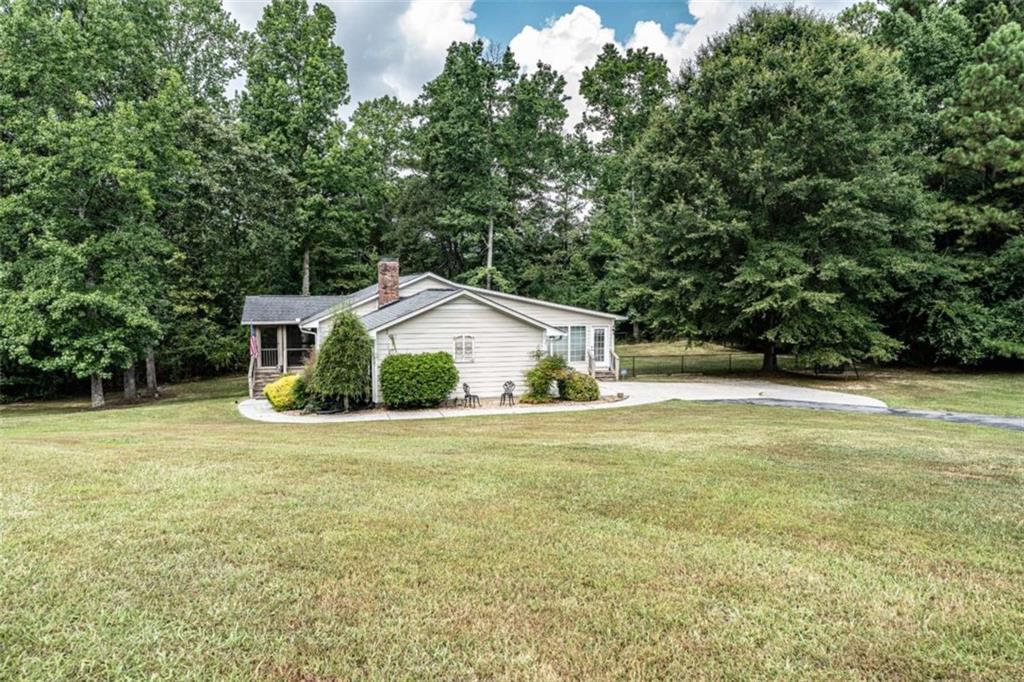 45 Wildflower Road Northeast Rome, GA 30161 - Photo 4 of 36 a view of a house with a yard and basketball court