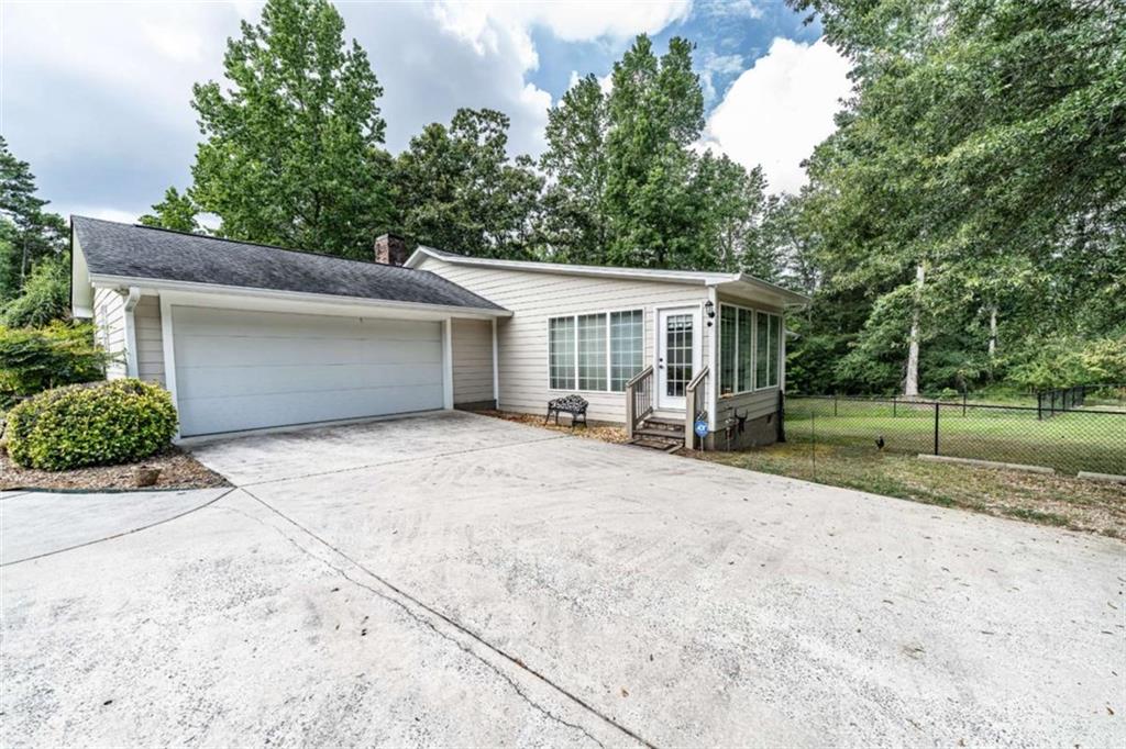 45 Wildflower Road Northeast Rome, GA 30161 - Photo 5 of 36 front view of a house with a outdoor space