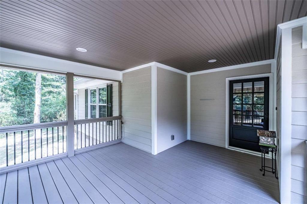 45 Wildflower Road Northeast Rome, GA 30161 - Photo 8 of 36 an empty room with wooden floor and windows