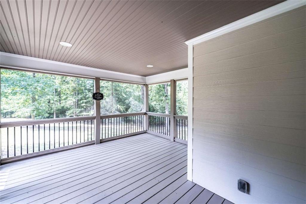 45 Wildflower Road Northeast Rome, GA 30161 - Photo 10 of 36 an empty room with wooden floor and windows