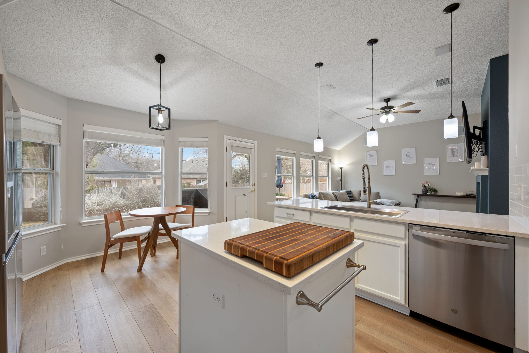 8509 Moose Cove Austin, TX 78749 - Photo 14 of 40 a kitchen with a table chairs stove and wooden floor