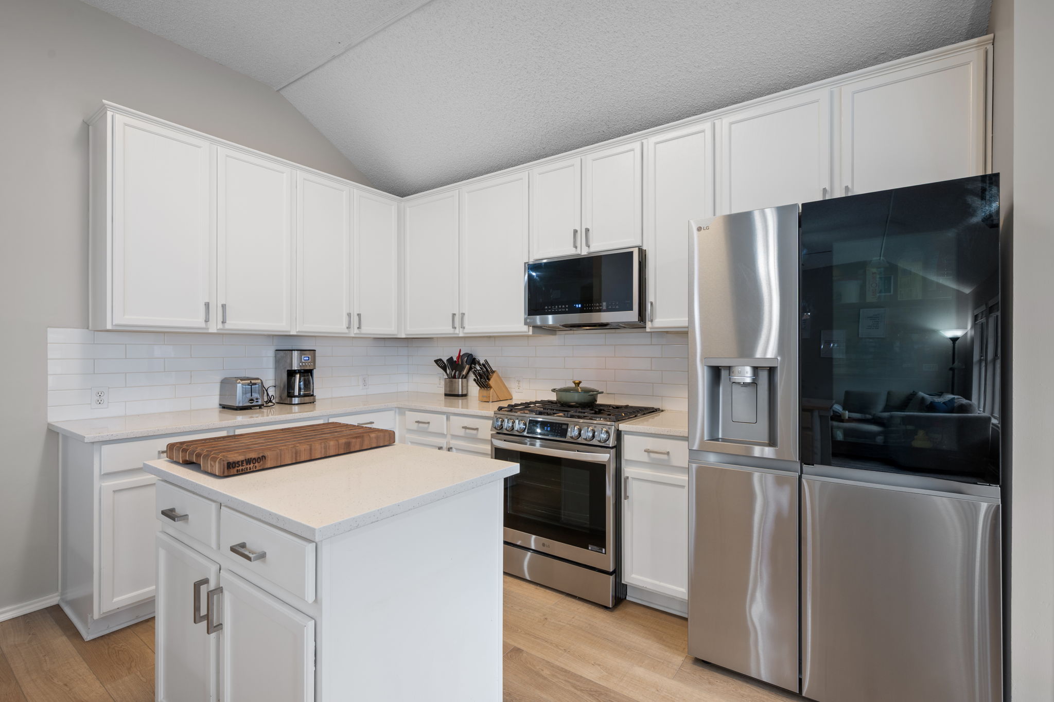 8509 Moose Cove Austin, TX 78749 - Photo 15 of 40 a kitchen with a sink stove and refrigerator