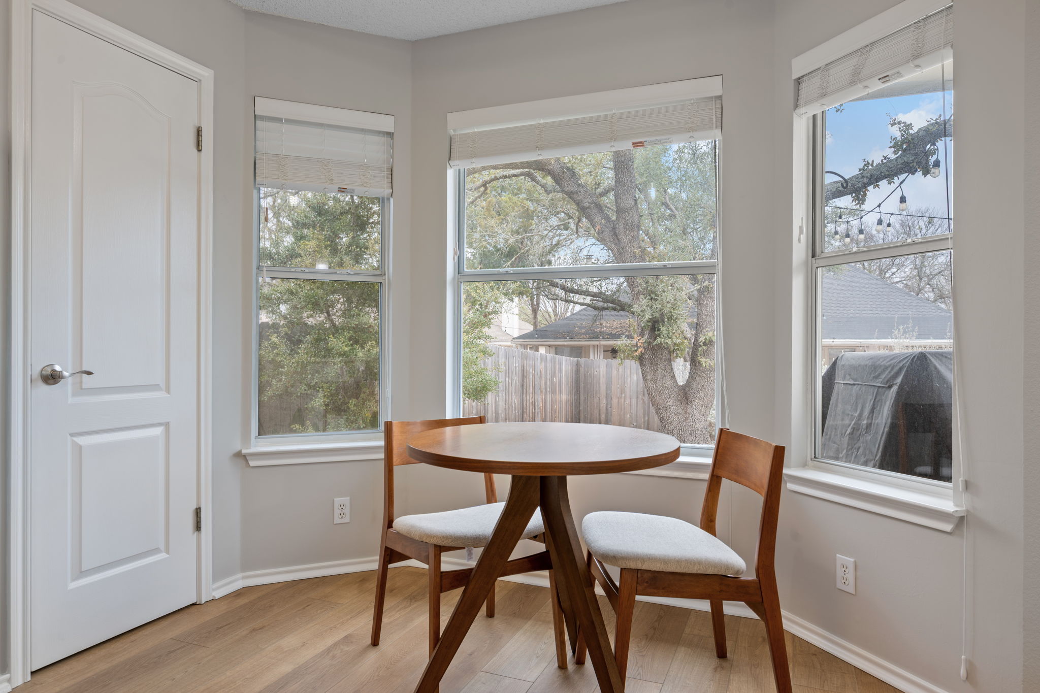 8509 Moose Cove Austin, TX 78749 - Photo 16 of 40 a view of a dining room with furniture window and wooden floor