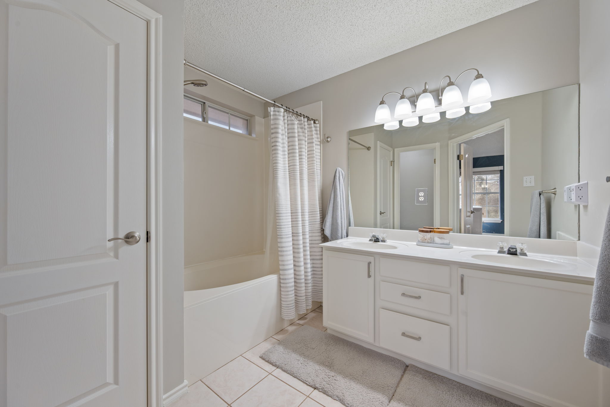 8509 Moose Cove Austin, TX 78749 - Photo 23 of 40 a bathroom with a double vanity sink mirror and bathtub