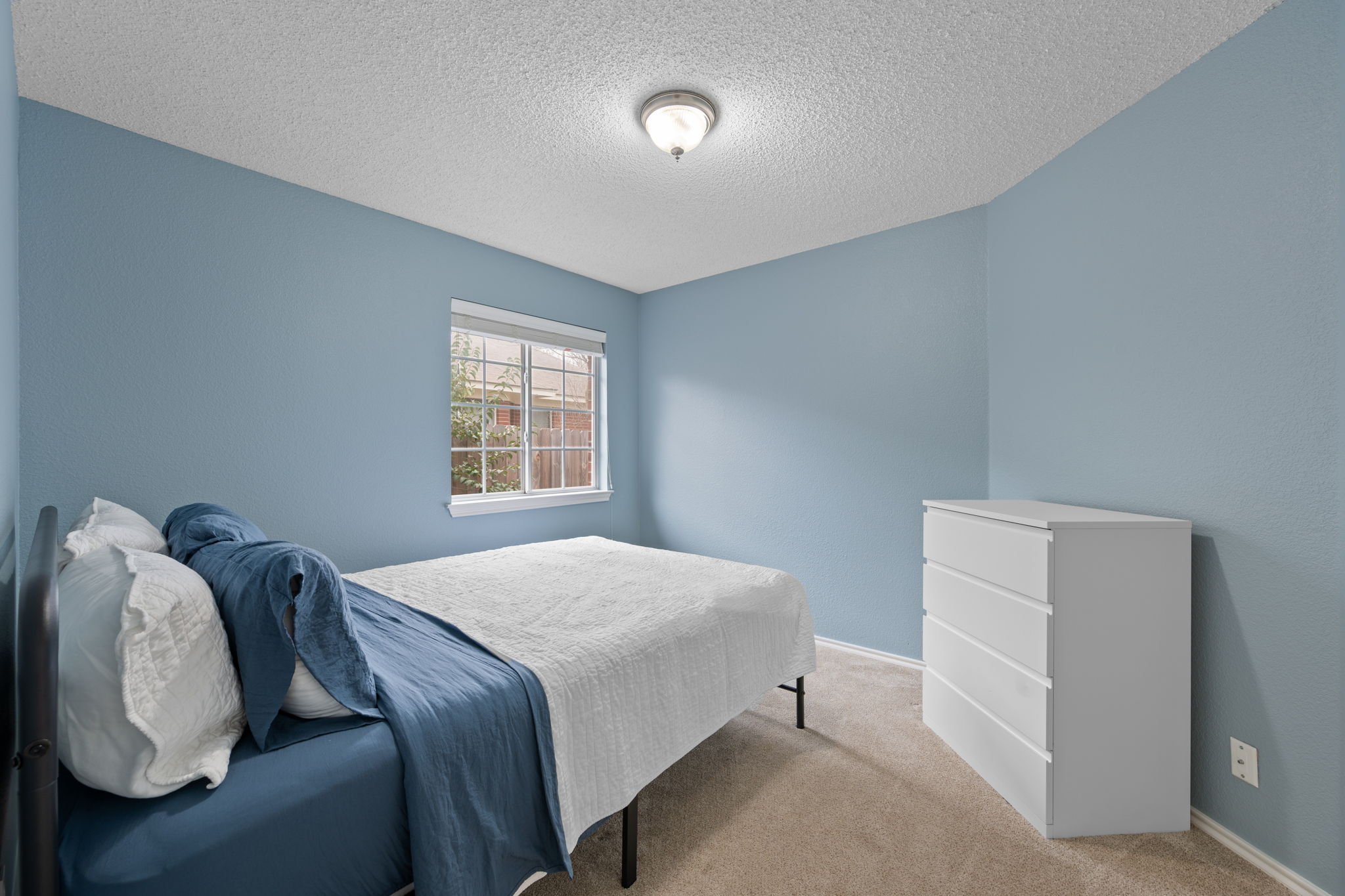 8509 Moose Cove Austin, TX 78749 - Photo 29 of 40 a bedroom with a bed and a window