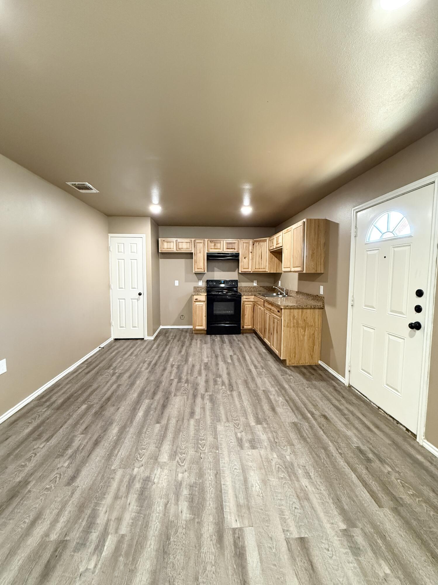 524 46th Street, Unit B Lubbock, TX 79404 - Photo 2 of 14 a view of kitchen with cabinets