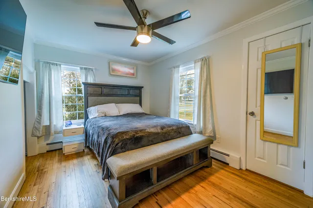 a bathroom with a shower sink and mirror